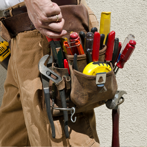 Carpenter’s tool bag with wood repair tools used for dry rot repair and exterior painting preparation in Vancouver, WA.