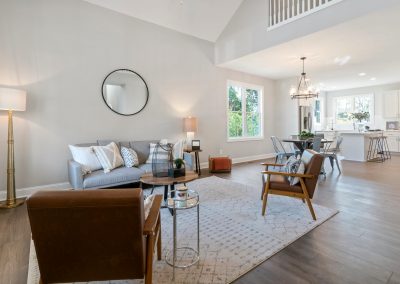 Bright modern living room with freshly painted neutral walls and natural light.